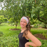 Adult women's ivory headband with soft pink, coral and green watercolor floral print