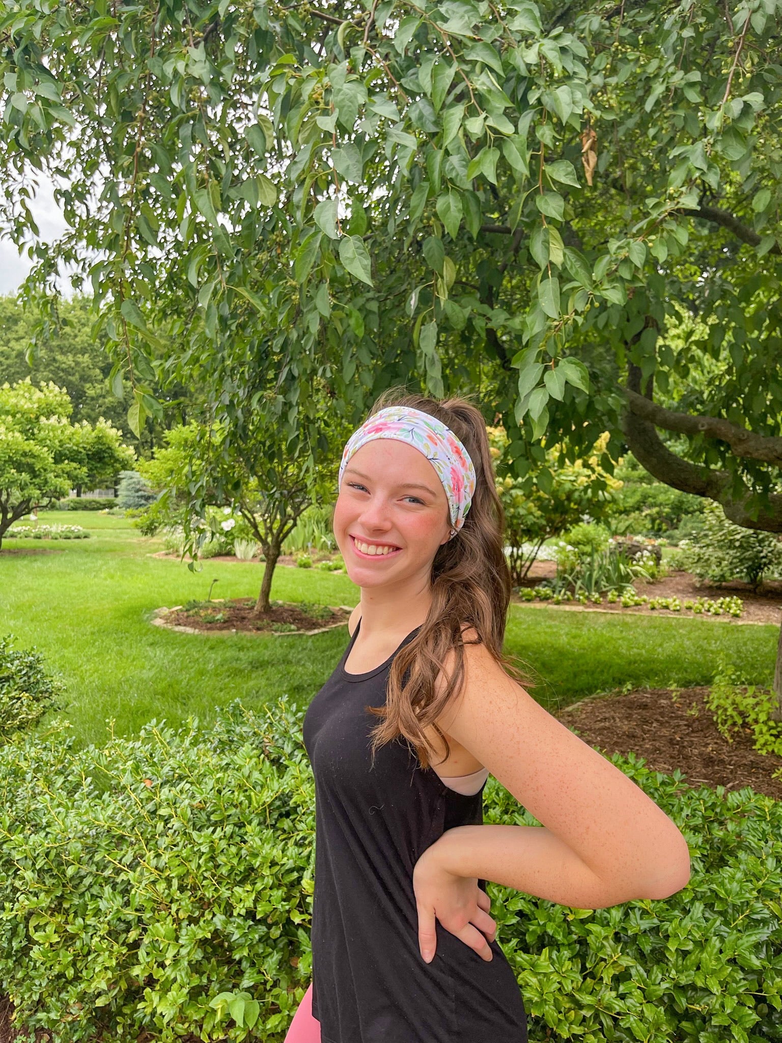 Adult women's ivory headband with soft pink, coral and green watercolor floral print