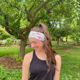 Adult women's ivory headband with soft pink, coral and green watercolor floral print