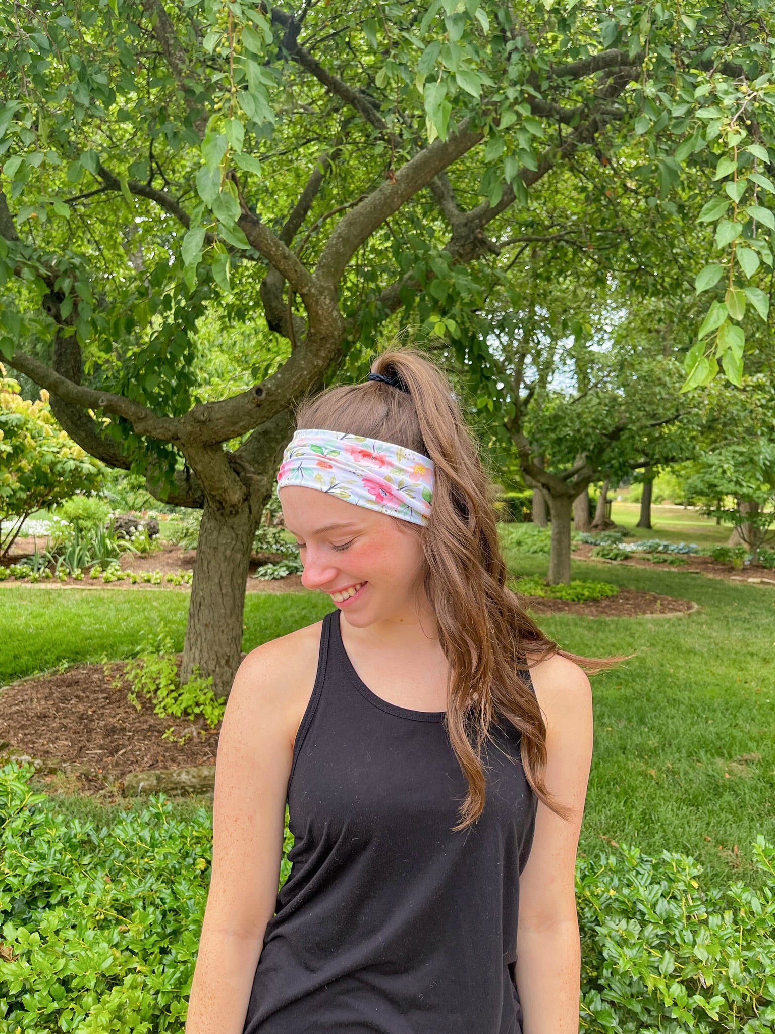 Adult women's ivory headband with soft pink, coral and green watercolor floral print