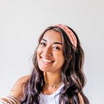 Adult women's burnt orange headband with allover dark orange and white sunsets