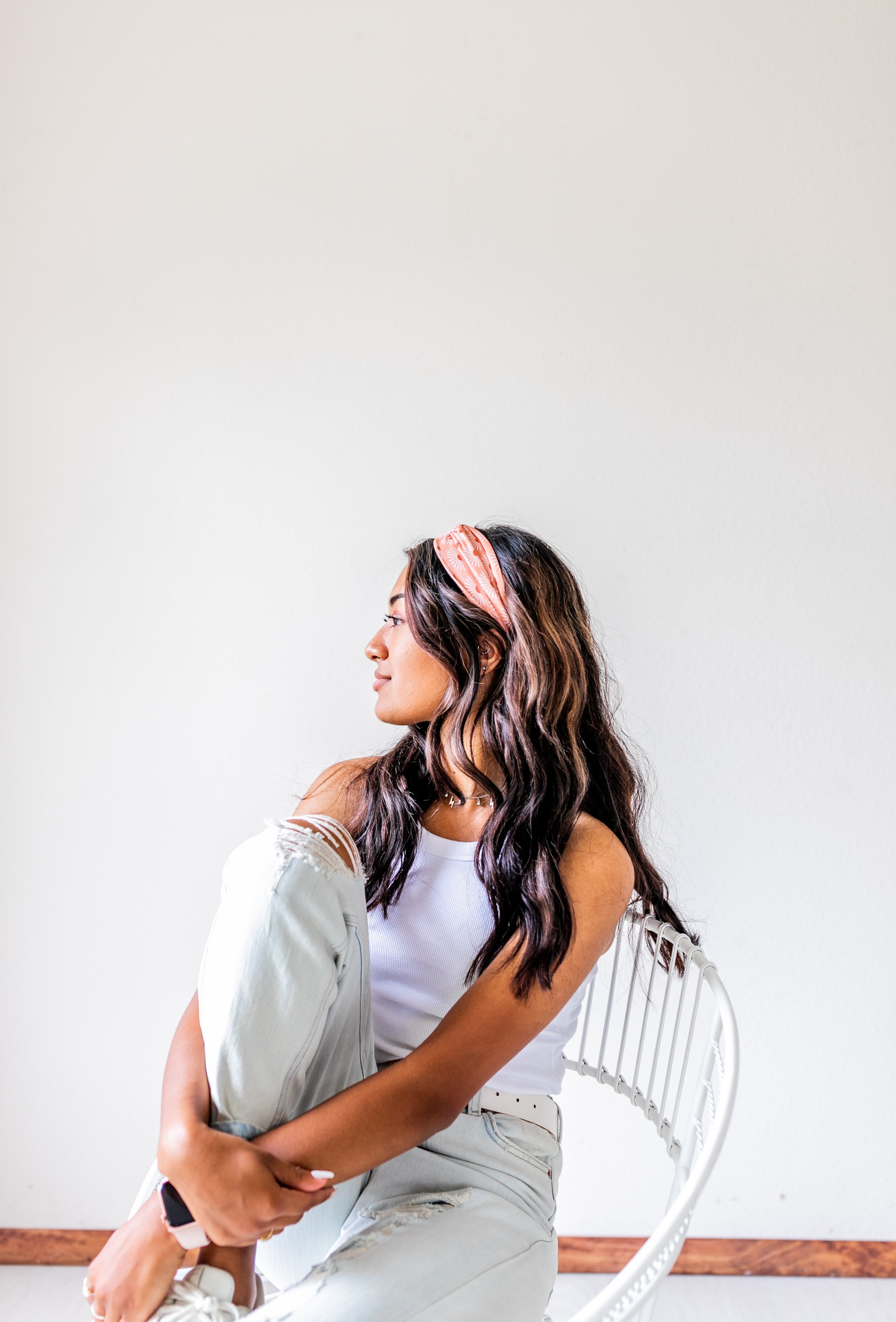 Adult women's burnt orange headband with allover dark orange and white sunsets