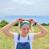 Adult women's dark green headband with yellow corn on the husk with different shades of green leaves