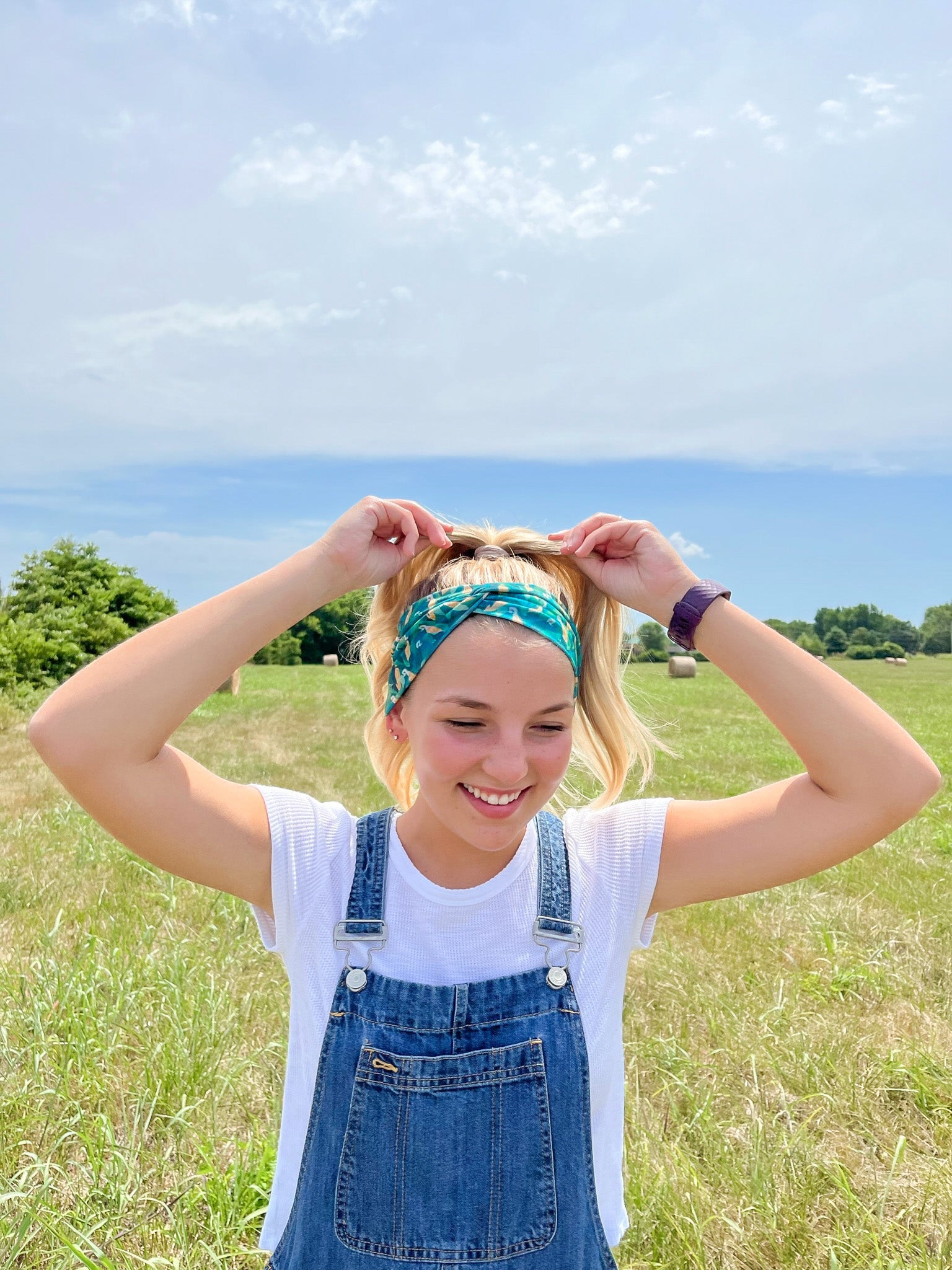 Adult women's dark green headband with yellow corn on the husk with different shades of green leaves