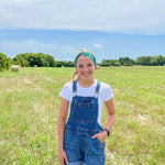 Adult women's dark green headband with yellow corn on the husk with different shades of green leaves