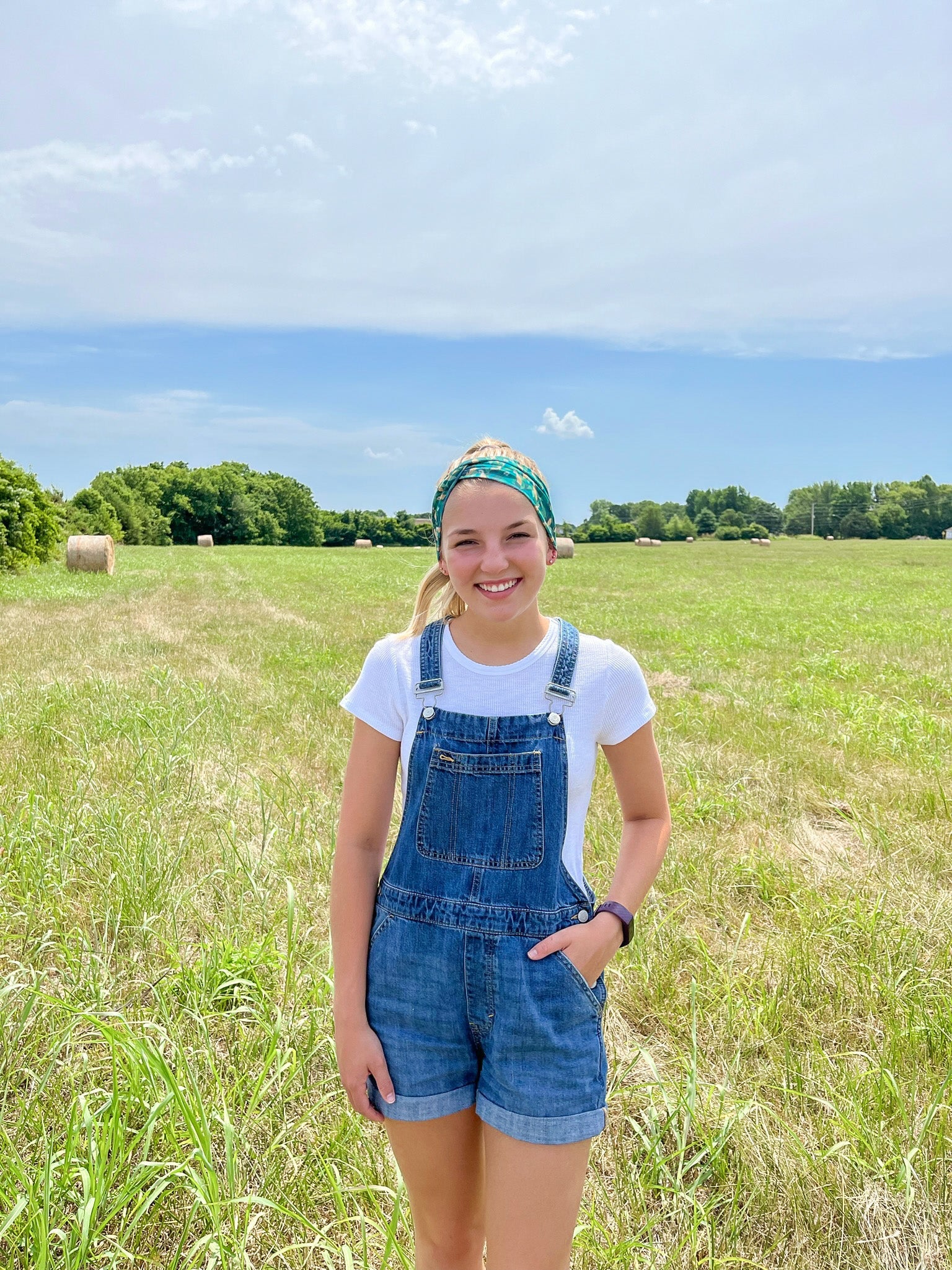 Adult women's dark green headband with yellow corn on the husk with different shades of green leaves
