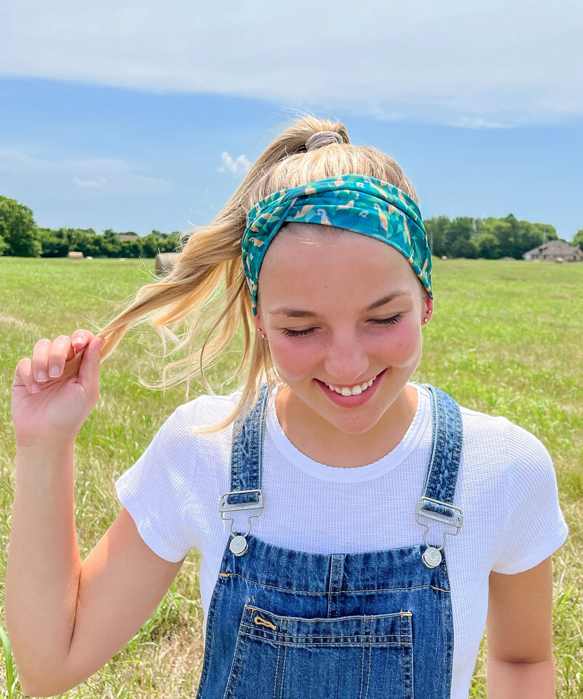 Adult women's dark green headband with yellow corn on the husk with different shades of green leaves