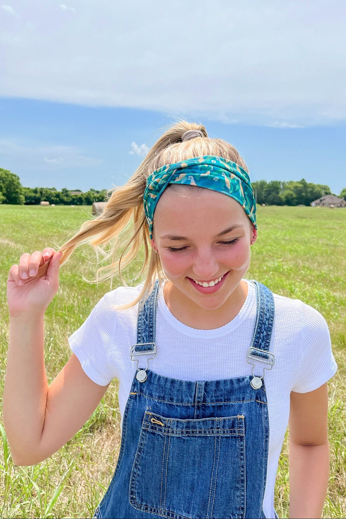 Adult women's dark green headband with yellow corn on the husk with different shades of green leaves