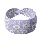 Adult women’s purple headband with medium white, dark and light purple floral allover pattern.