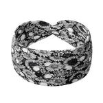 Adult women's black headband with allover white skulls and daisies print
