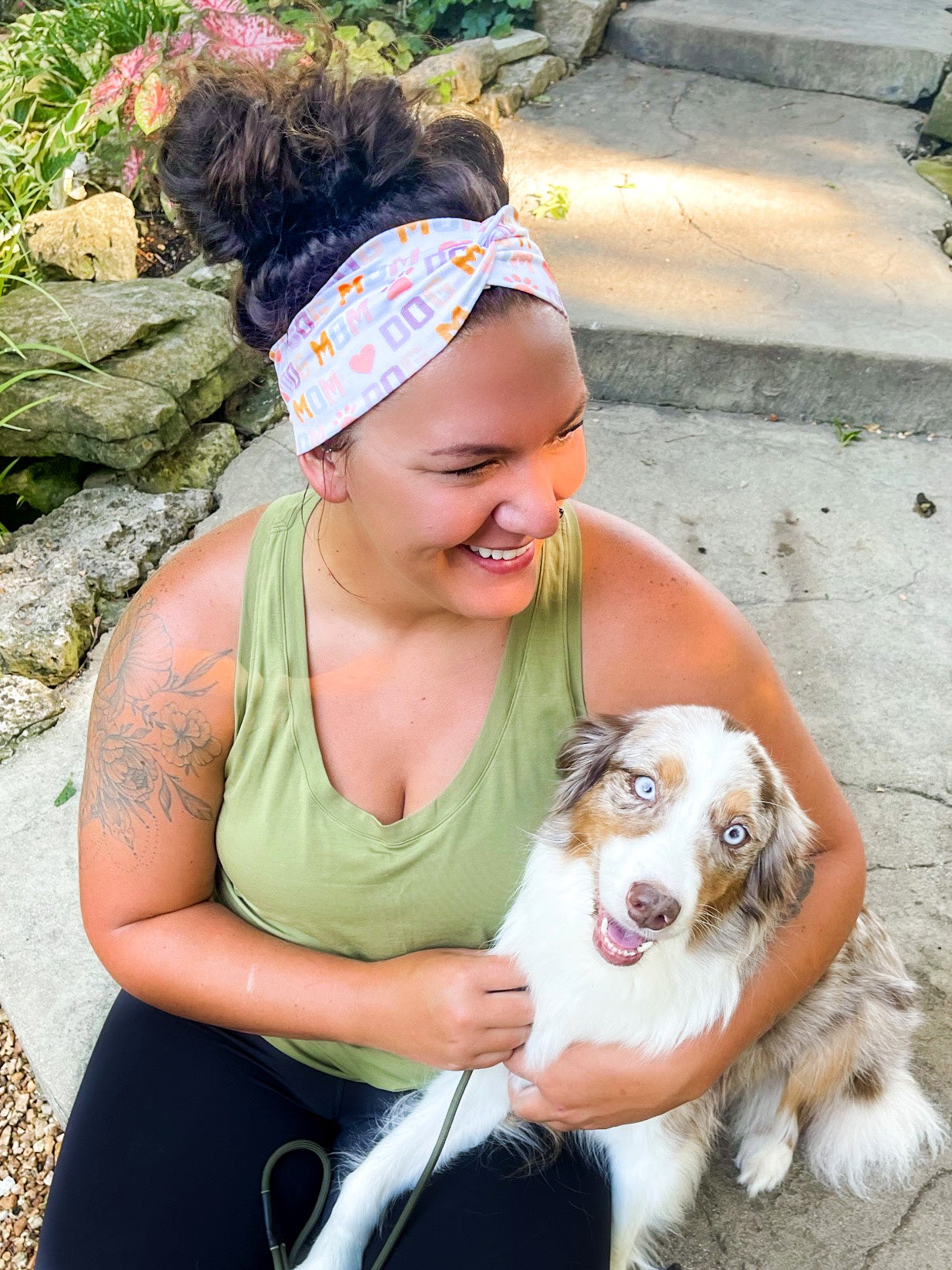 Adult women's white headband with orange, slate, tan, blush and plum pawprints, hearts and words they say "dog mom"