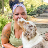 Adult women's white headband with orange, slate, tan, blush and plum pawprints, hearts and words they say "dog mom"