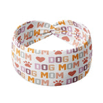 Adult women's white headband with orange, slate, tan, blush and plum pawprints, hearts and words they say "dog mom"
