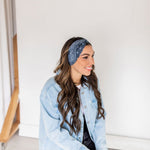 Adult women’s black headband with white paisley bandana print.