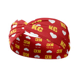 Adult women's red headband with white hearts and bright yellow "KC" pattern