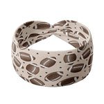 Adult women's tan headband with allover brown footballs and tiny black stars