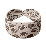 Adult women's tan headband with allover brown footballs and tiny black stars