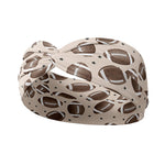 Adult women's tan headband with allover brown footballs and tiny black stars