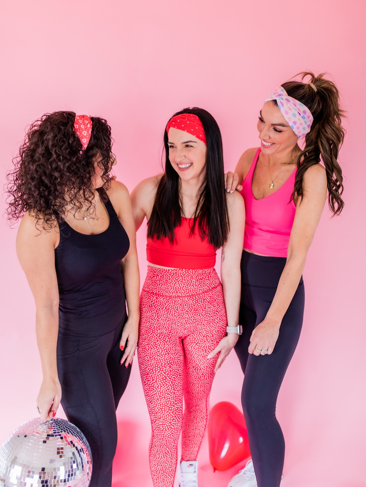 Adult women's peach headband with purple, blue, orange, yellow, green and pink candy hearts with various Valentine's sayings