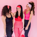 Adult women's peach headband with purple, blue, orange, yellow, green and pink candy hearts with various Valentine's sayings