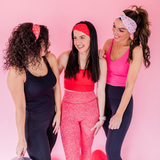 Adult women's peach headband with purple, blue, orange, yellow, green and pink candy hearts with various Valentine's sayings