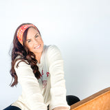 Adult women's red headband with yellow and white 1970's bubble script with the phrase "Chiefs" and an arrowhead