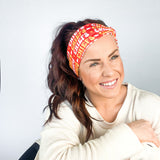 Adult women's red headband with yellow and white 1970's bubble script with the phrase "Chiefs" and an arrowhead