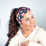 Adult women's black headband with yellow, red and white artistic cartoons of Patrick Mahomes, Avery Reid and Travis Kelce