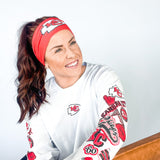 Adult women's red headband with one white arrowhead and red "KC" font in the center