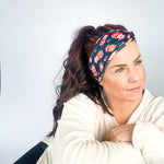 Adult women's black headband with yellow, red and white artistic cartoons of Patrick Mahomes, Avery Reid and Travis Kelce