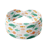 Adult women's white headband with sea life of green sea turtles, pink jellyfish, orange clownfish and other coral and teal fish