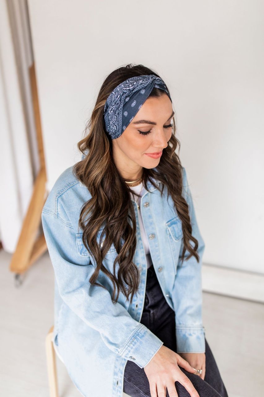 Adult women’s black headband with white paisley bandana print.