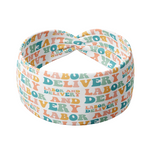Adult women's white headband with the words "Labor and Delivery" in 70's bubble font with each letter a different color of orange, teal, pink, and green