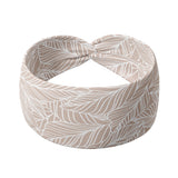 Adult women's blush headband with allover white outlines of frond leaves