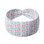Adult women's white headband with pink and blue allover text saying "nurse"