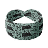 Adult women's sage headband with black cat art peaking over with small black flower and dot outlines