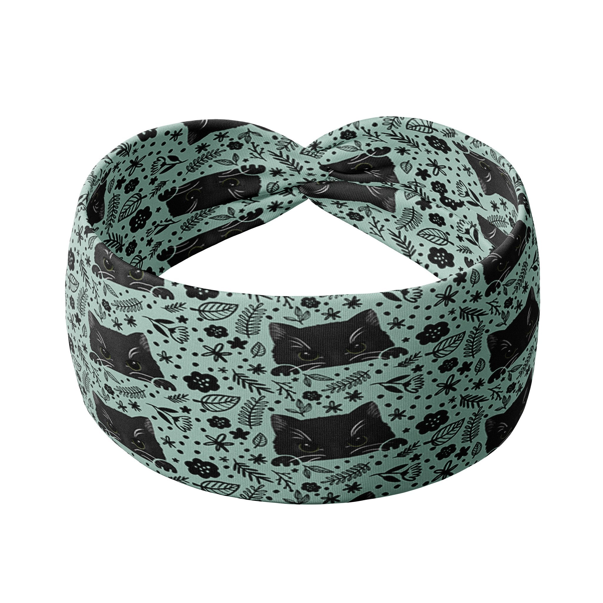 Adult women's sage headband with black cat art peaking over with small black flower and dot outlines