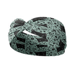 Adult women's sage headband with black cat art peaking over with small black flower and dot outlines