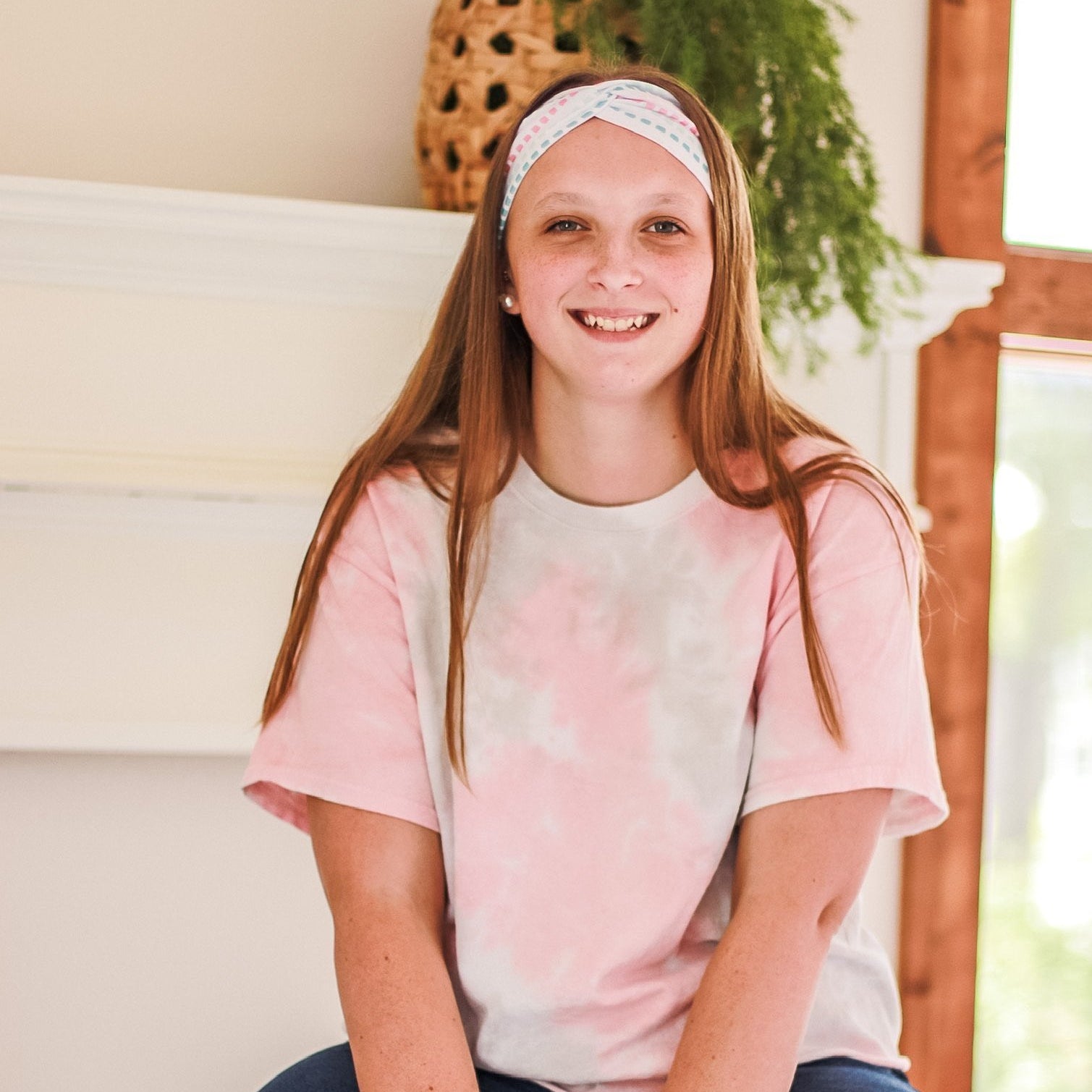 Adult women's ivory headband with coral, blue and grey squares in rows print