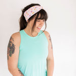 Adult women's white headband with orange, slate, tan, blush and plum pawprints, hearts and words they say "cat mom"